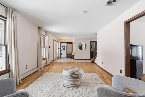 a living room with furniture and a window