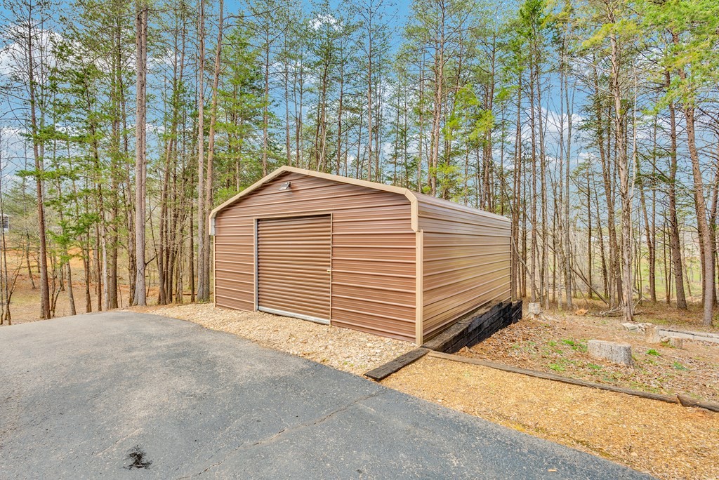 465 Hickory Lane Sparta, TN 38583 - Photo 20 of 46 a view of a house with a yard and garage