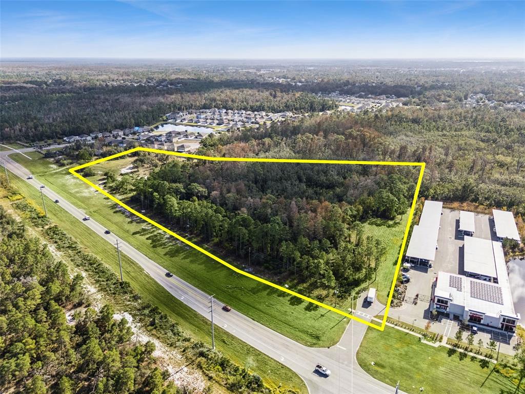 Osceola Polk Line Road Davenport, FL 33896 - Photo 14 of 16 an aerial view of a residential houses with swimming pool