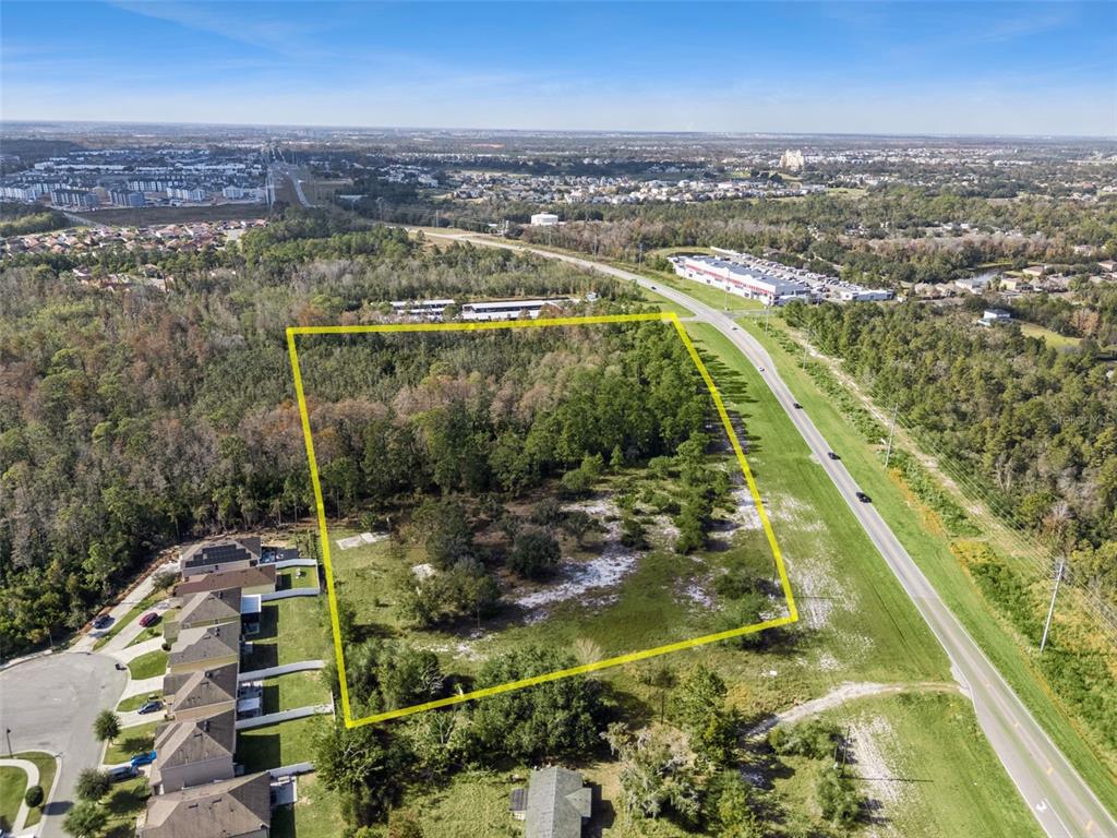 Osceola Polk Line Road Davenport, FL 33896 - Photo 15 of 16 an aerial view of residential houses with outdoor space