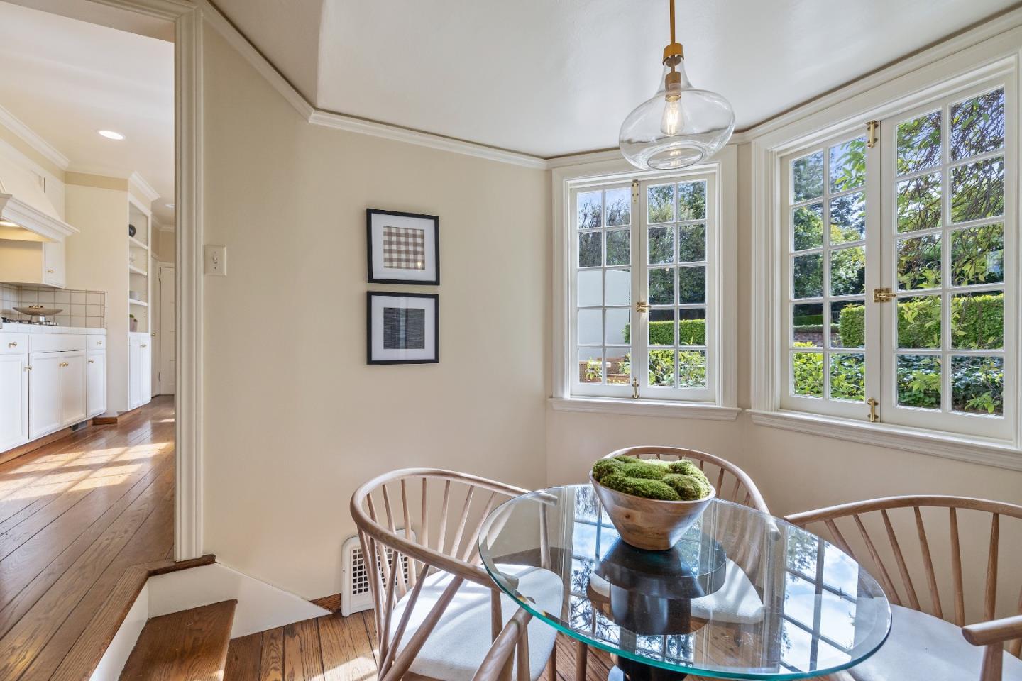 460 Edgewood Road San Mateo, CA 94402 - Photo 11 of 40 a view of a dining room with furniture a chandelier and wooden floor