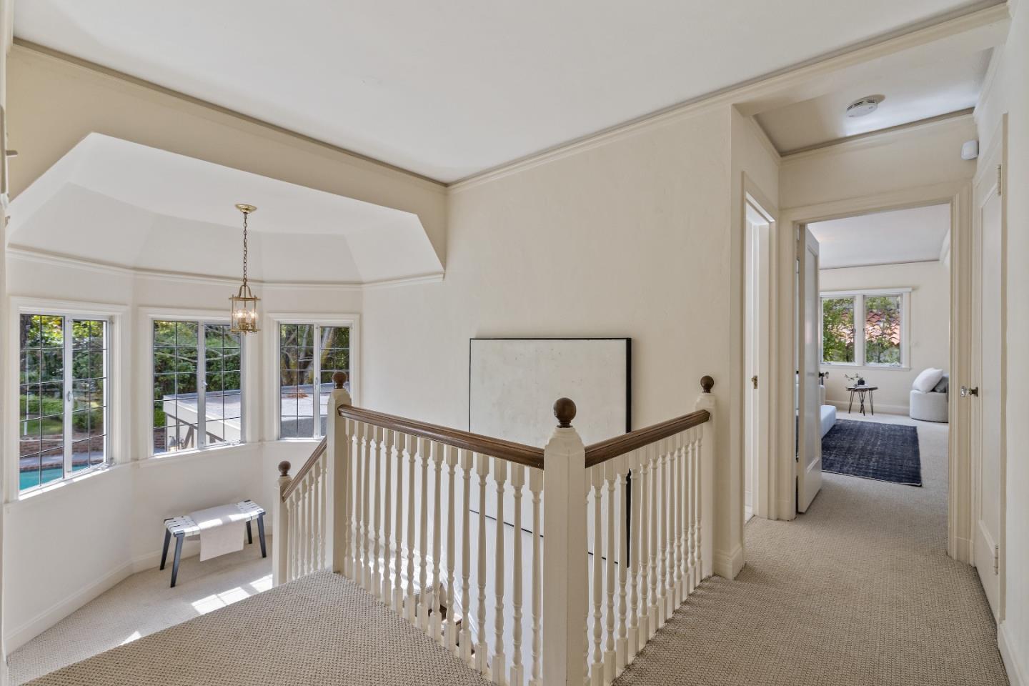 460 Edgewood Road San Mateo, CA 94402 - Photo 16 of 40 a view of a hallway to a livingroom with furniture and windows