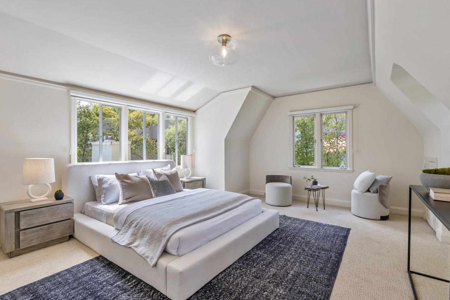 460 Edgewood Road San Mateo, CA 94402 - Photo 20 of 40 a bedroom with a large bed and wooden floor