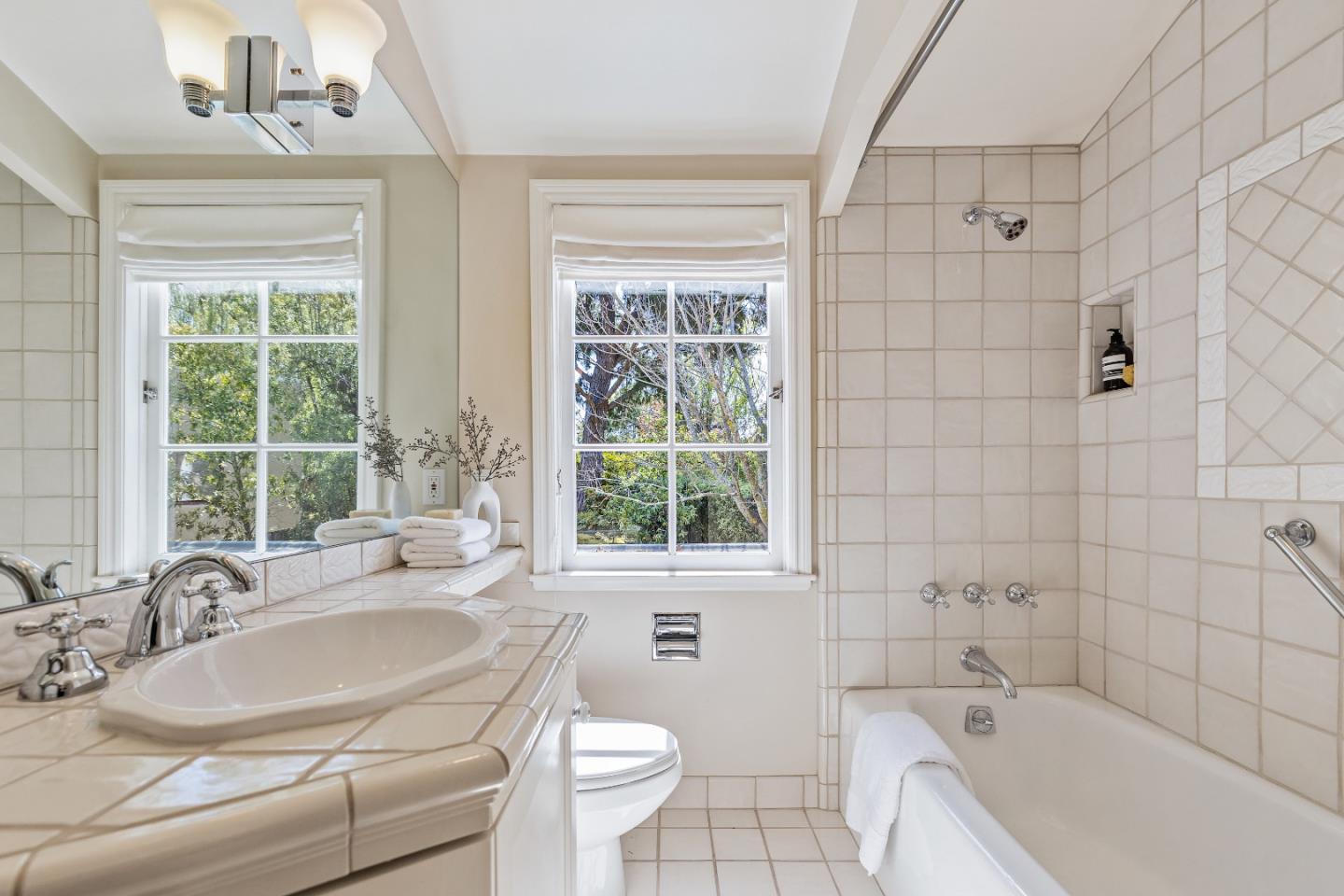 460 Edgewood Road San Mateo, CA 94402 - Photo 22 of 40 a bathroom with a sink mirror toilet and bathtub