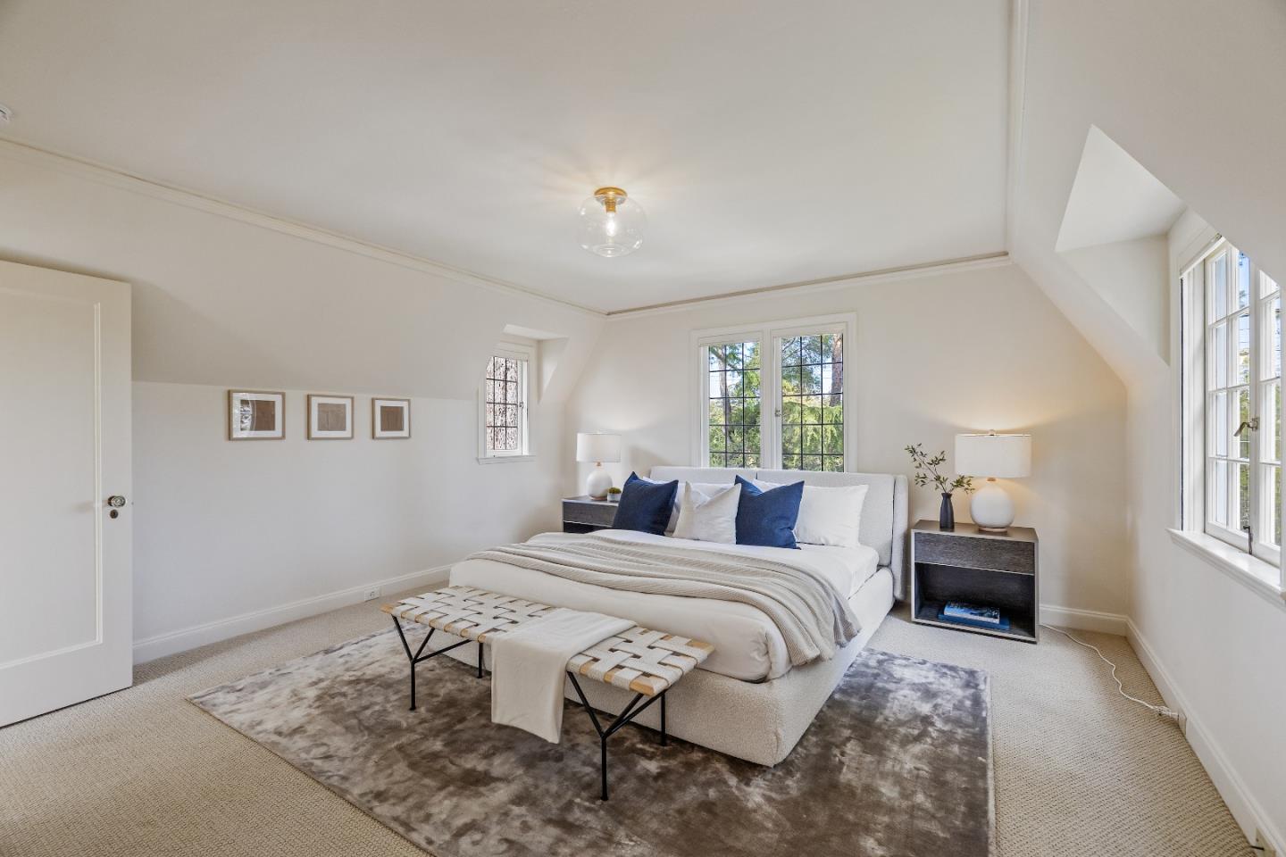 460 Edgewood Road San Mateo, CA 94402 - Photo 23 of 40 a bedroom with a bed and wooden floor
