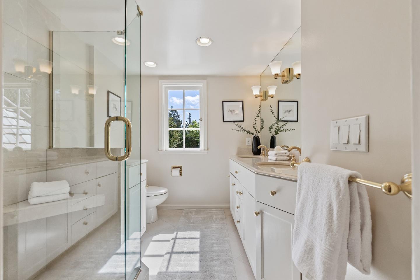 460 Edgewood Road San Mateo, CA 94402 - Photo 24 of 40 a bathroom with a double vanity sink a toilet and a shower