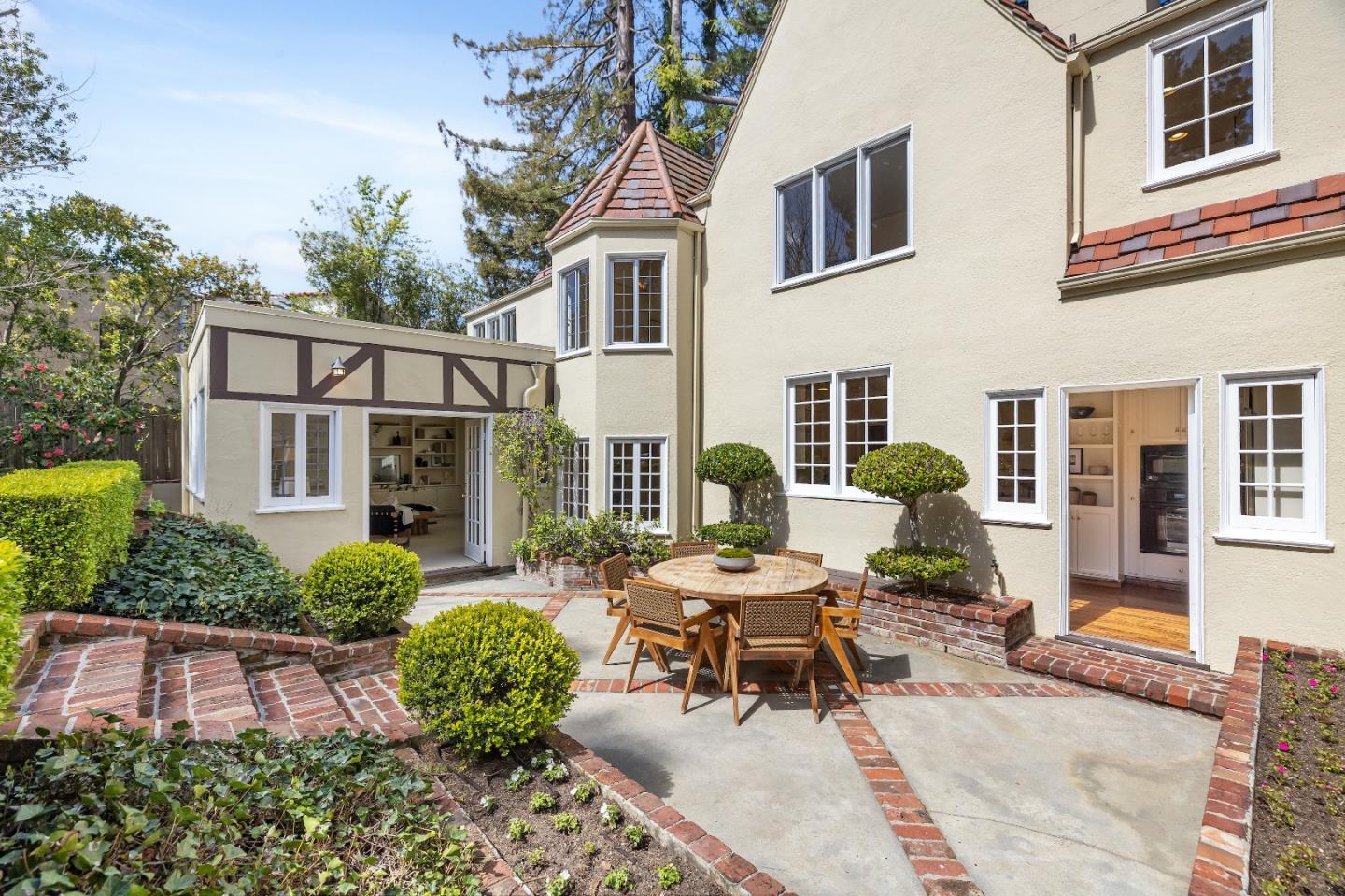 460 Edgewood Road San Mateo, CA 94402 - Photo 32 of 40 a view of a patio with couches table and chairs and potted plants