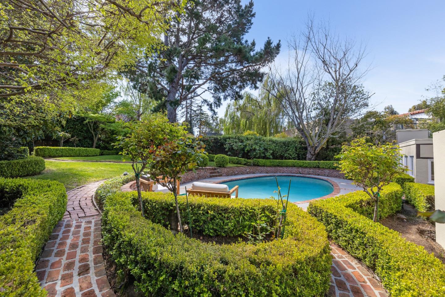 460 Edgewood Road San Mateo, CA 94402 - Photo 36 of 40 a view of a swimming pool with a yard