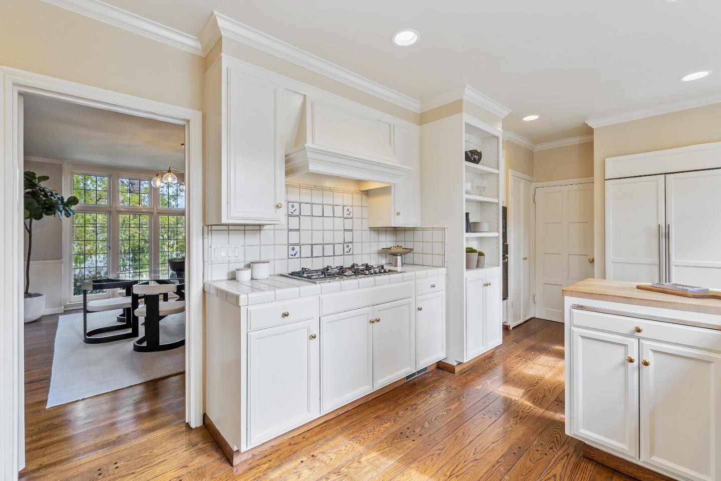 460 Edgewood Road San Mateo, CA 94402 - Photo 9 of 40 a kitchen with granite countertop a sink cabinets and wooden floor