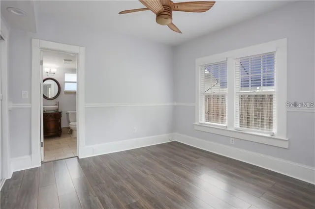 a bathroom with a toilet a sink and a mirror
