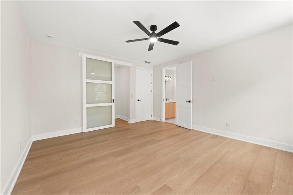 7066 Bells Way Fairburn, GA 30213 - Photo 55 of 64 a view of a livingroom with a ceiling fan