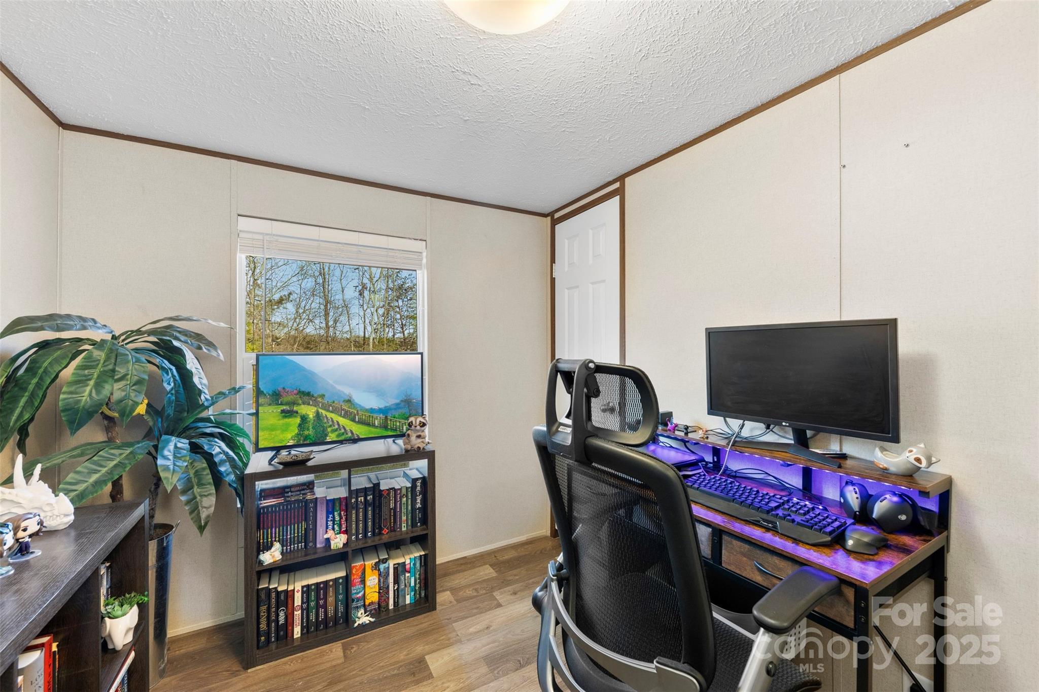 3051 Shoal Road Crouse, NC 28033 - Photo 12 of 26 a view of a livingroom with furniture and a flat screen tv