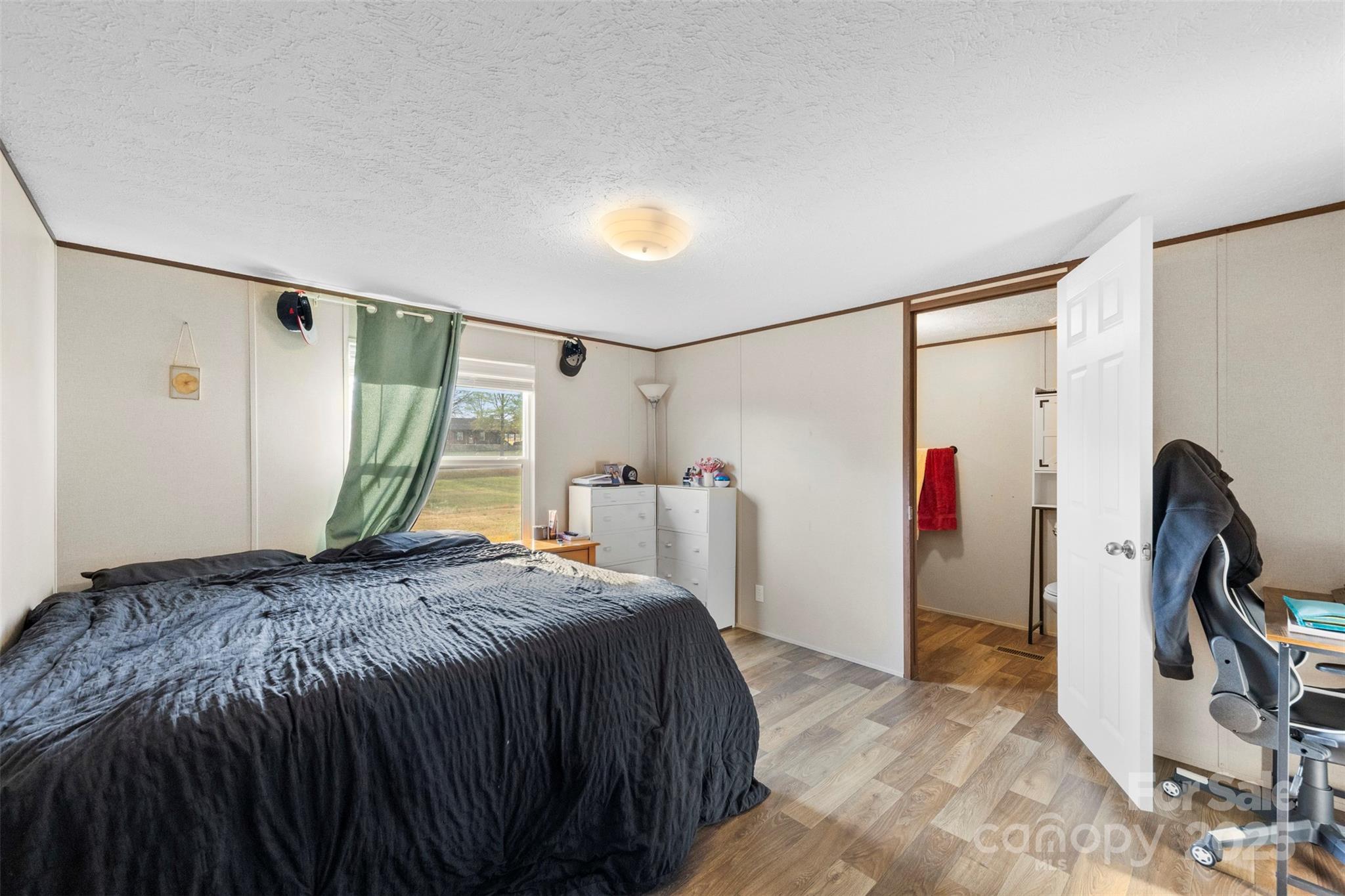 3051 Shoal Road Crouse, NC 28033 - Photo 14 of 26 a bed room with a bed and a window