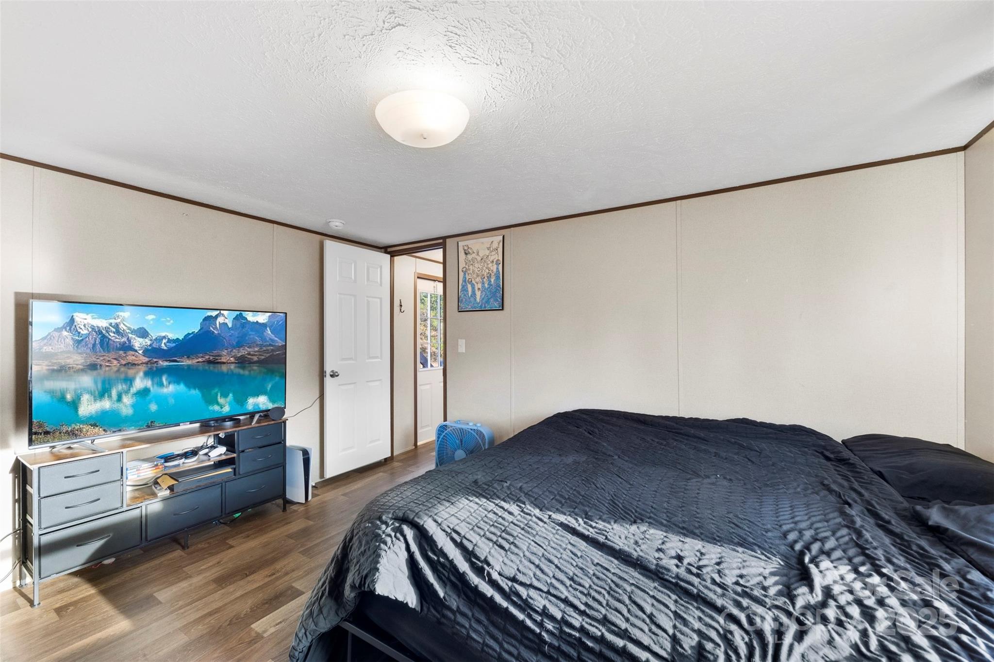 3051 Shoal Road Crouse, NC 28033 - Photo 15 of 26 a bedroom with a bed and a flat screen tv