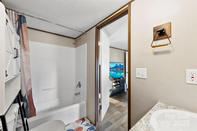 a bedroom with bed and a window