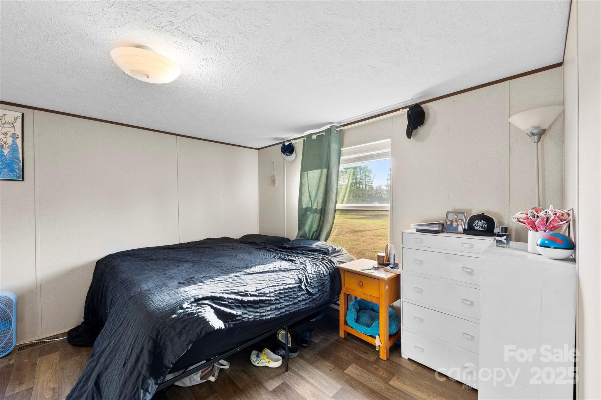 3051 Shoal Road Crouse, NC 28033 - Photo 19 of 26 a bed sitting in a bedroom next to a window