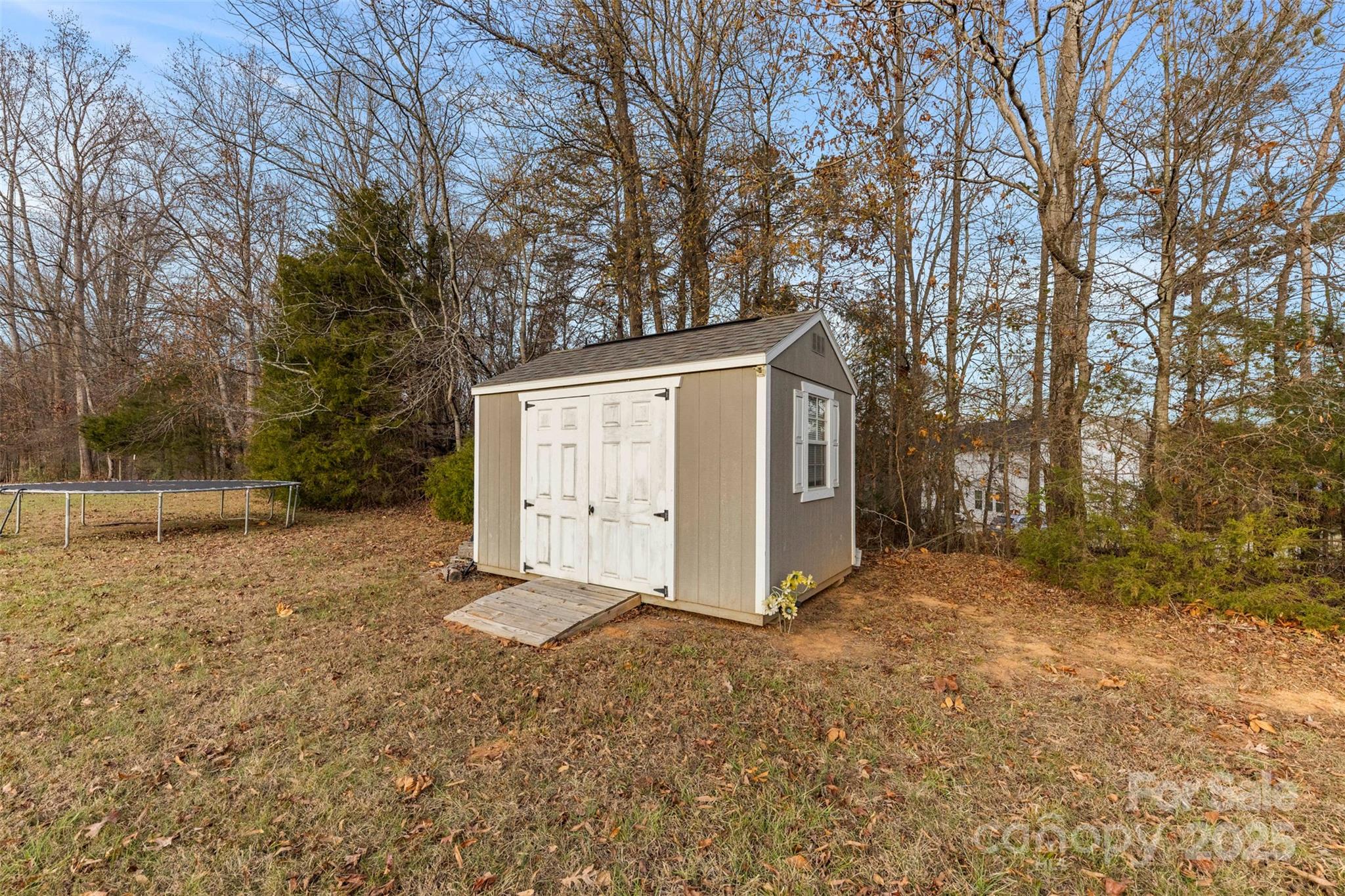 3051 Shoal Road Crouse, NC 28033 - Photo 22 of 26 a view of a house with a large tree and a yard