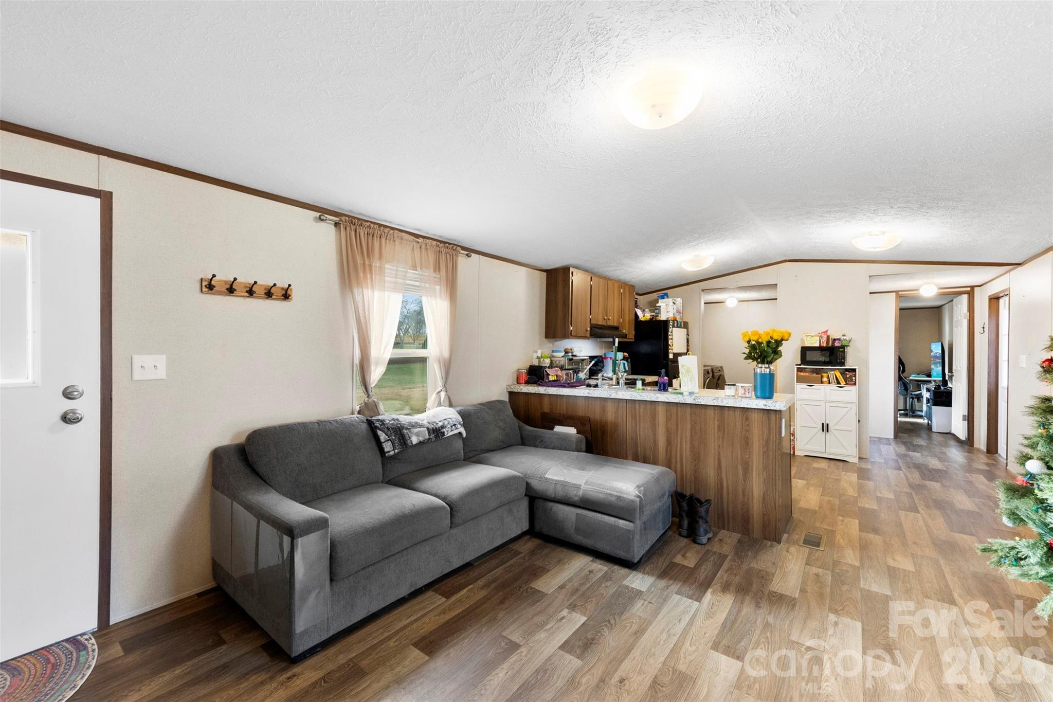 3051 Shoal Road Crouse, NC 28033 - Photo 5 of 26 a living room with furniture and a dining table with wooden floor