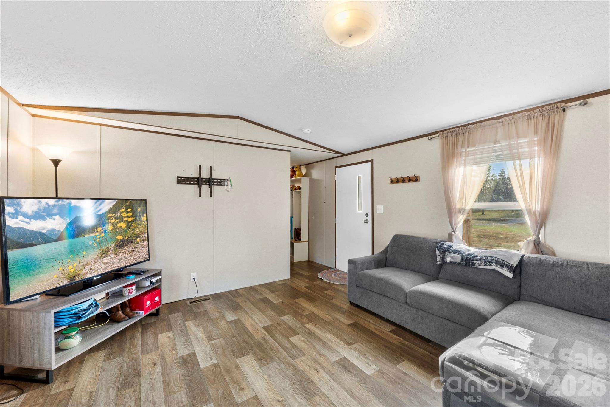 3051 Shoal Road Crouse, NC 28033 - Photo 6 of 26 a living room with furniture and a flat screen tv