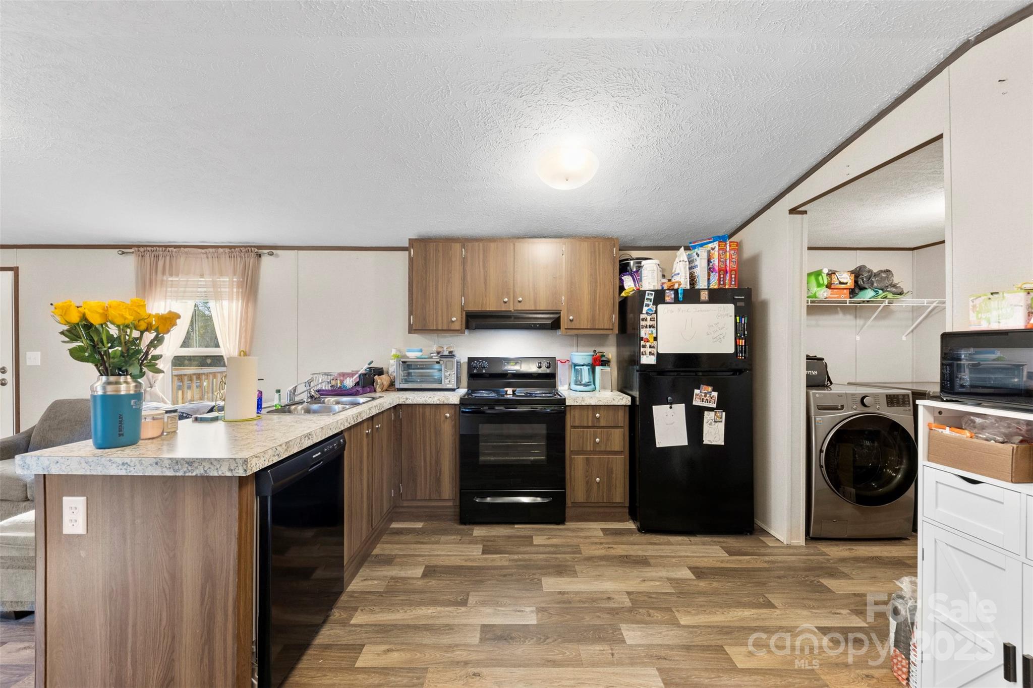 3051 Shoal Road Crouse, NC 28033 - Photo 7 of 26 a kitchen with stainless steel appliances granite countertop a stove and a refrigerator