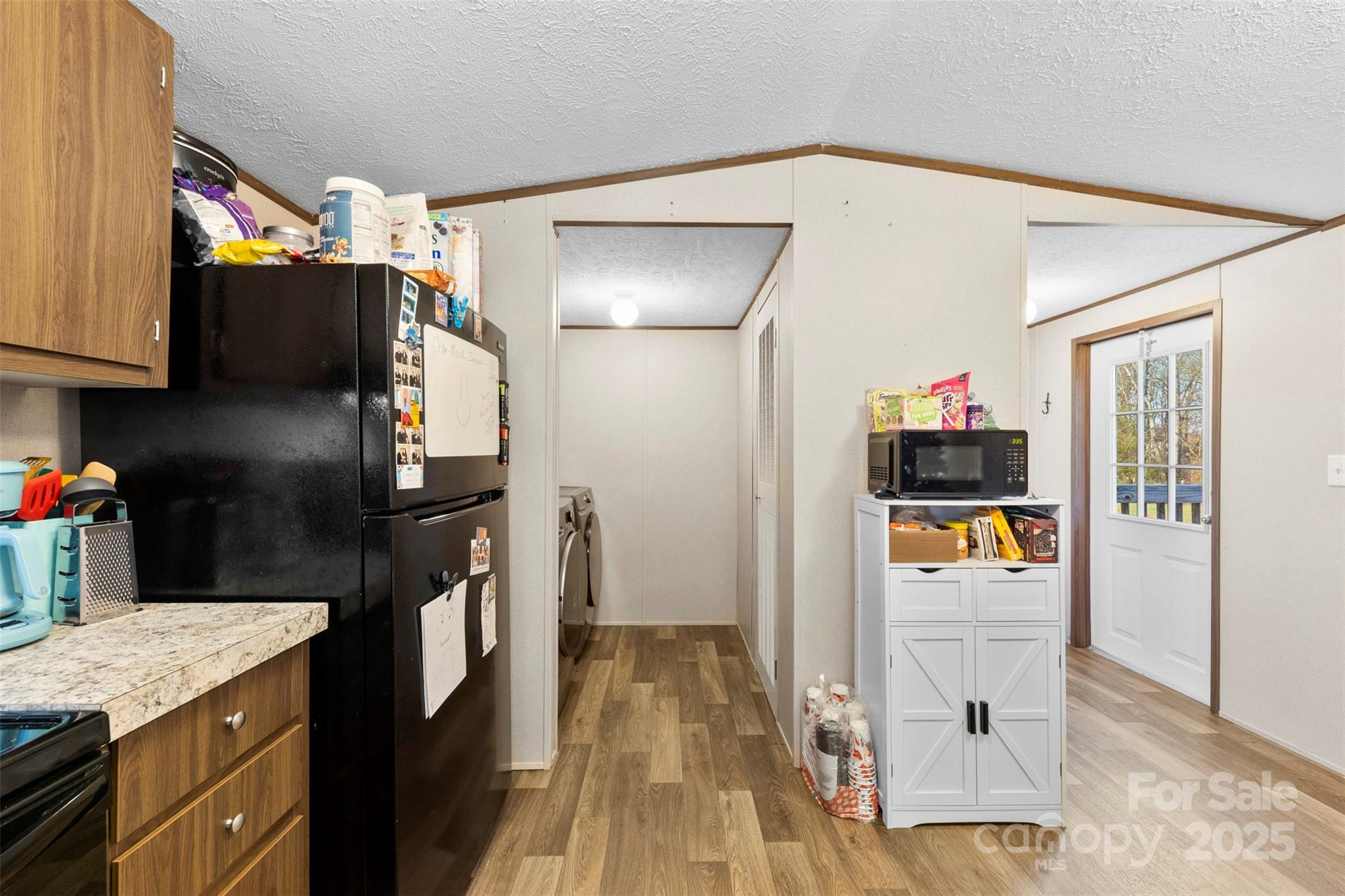 3051 Shoal Road Crouse, NC 28033 - Photo 9 of 26 a kitchen with stainless steel appliances kitchen island granite countertop a refrigerator a stove and a sink