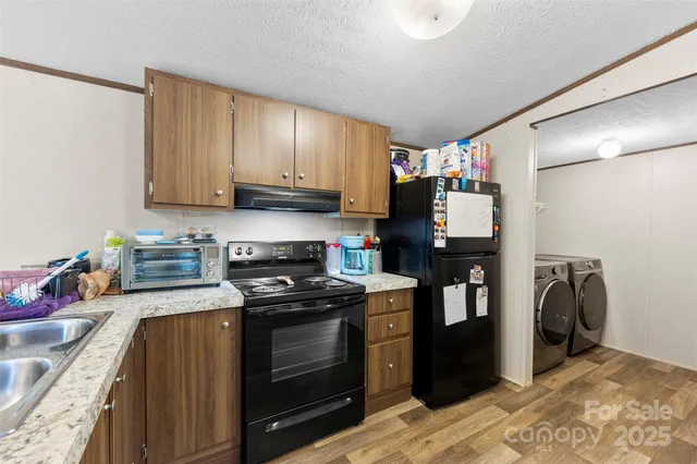 a view of a livingroom with furniture and a flat screen tv