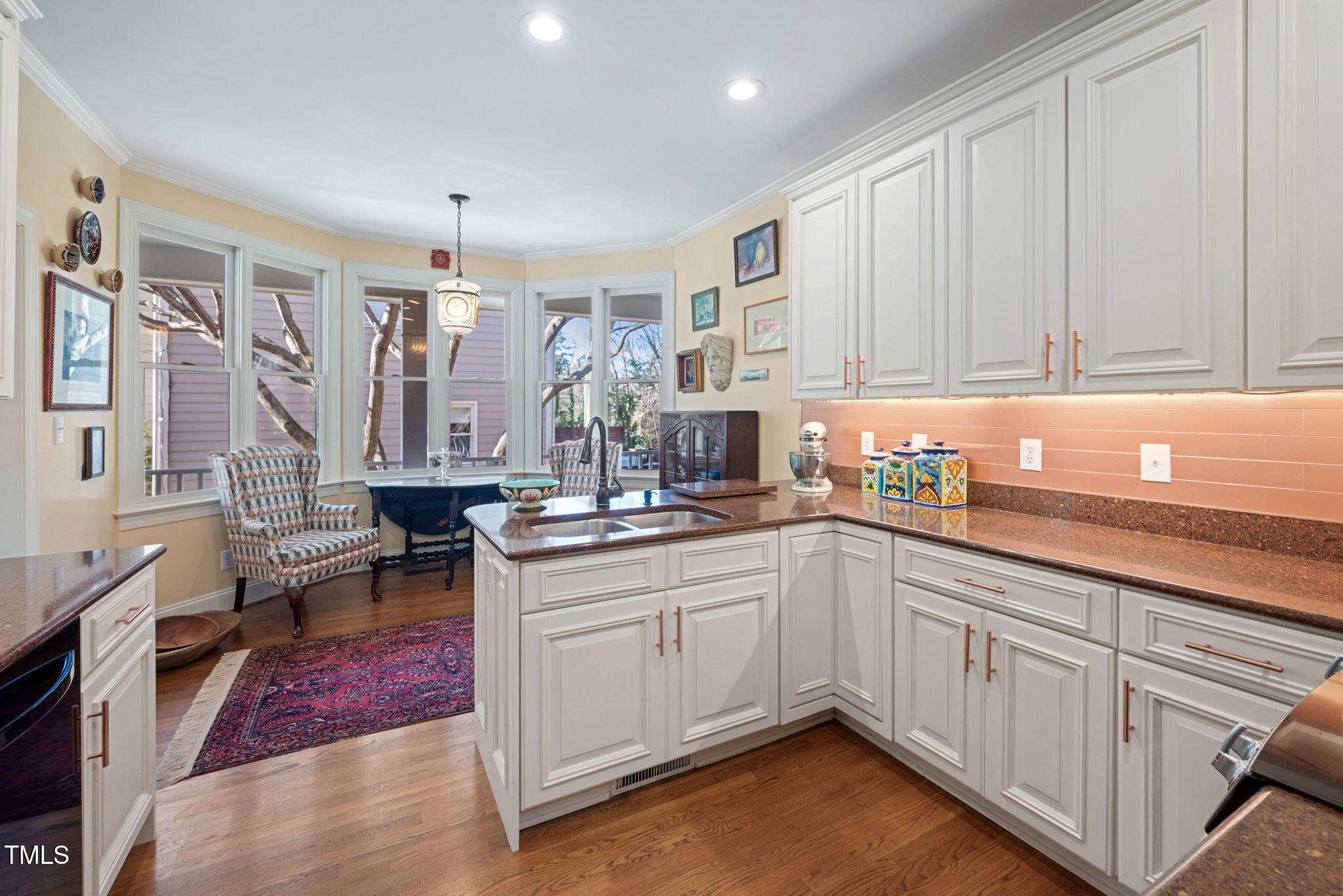 2714 B Clark Avenue Raleigh, NC 27607 - Photo 23 of 38 a kitchen with a sink cabinets and window