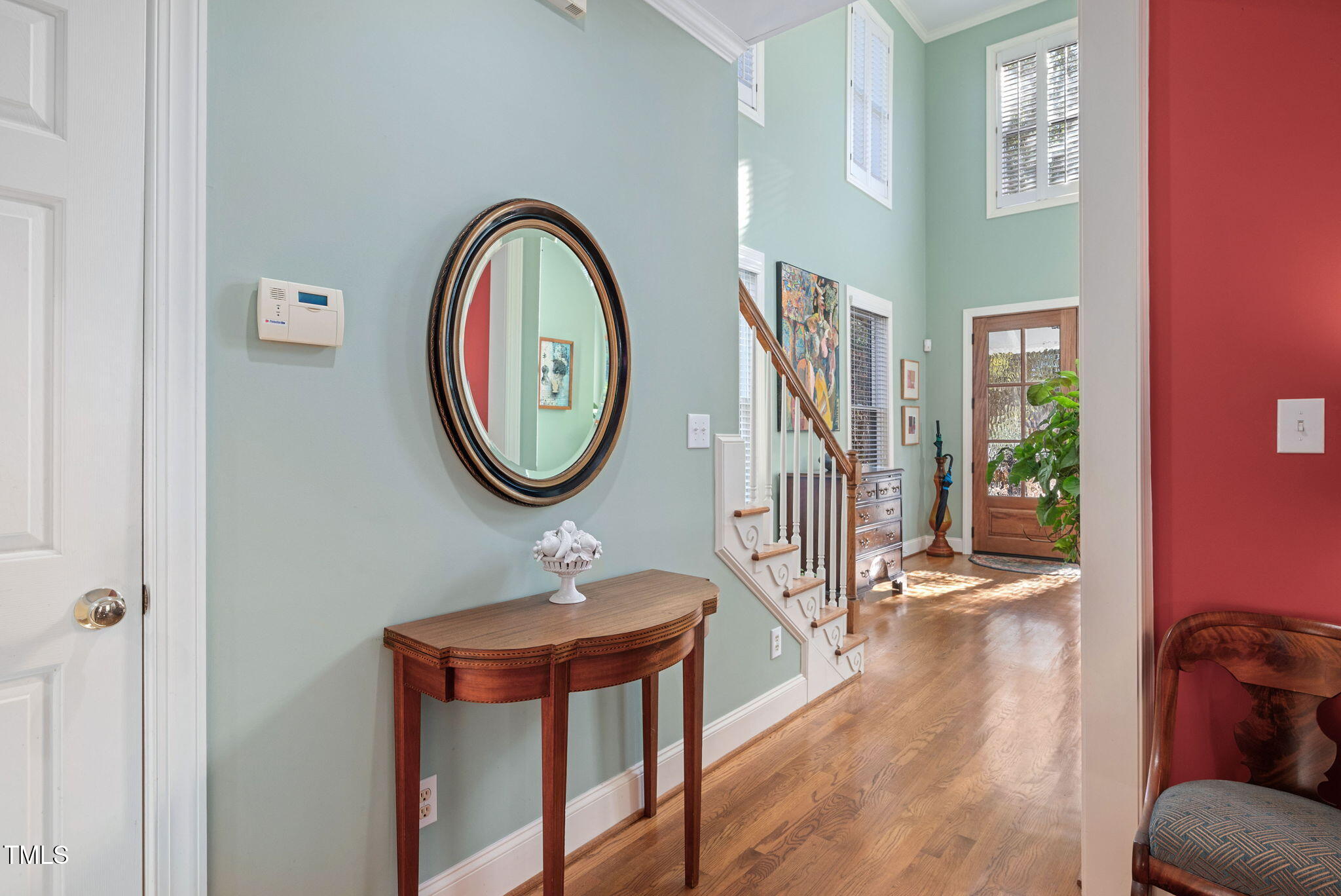 2714 B Clark Avenue Raleigh, NC 27607 - Photo 26 of 38 a view of a hallway with entryway wooden floor and a front door