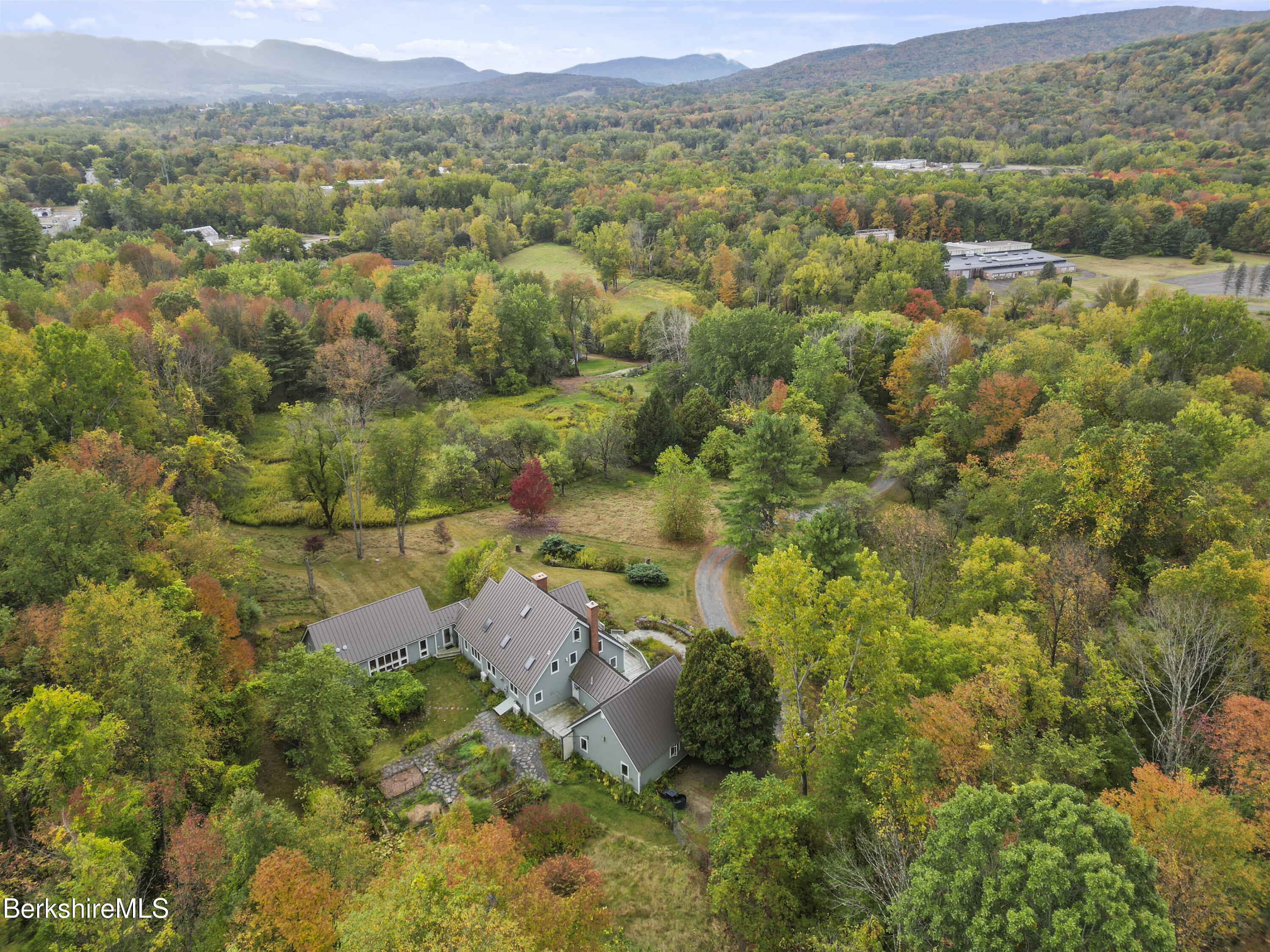 1030 Simonds Road Williamstown, MA 01267 - Photo 74 of 76 an aerial view of green landscape with trees houses and mountain view