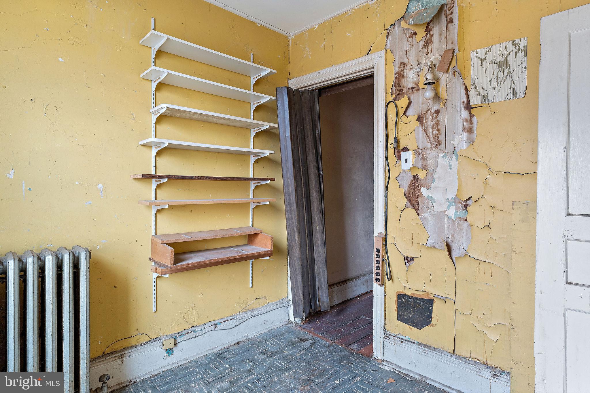 610 Point Street Camden, NJ 08102 - Photo 14 of 23 a view of walk in closet with empty racks