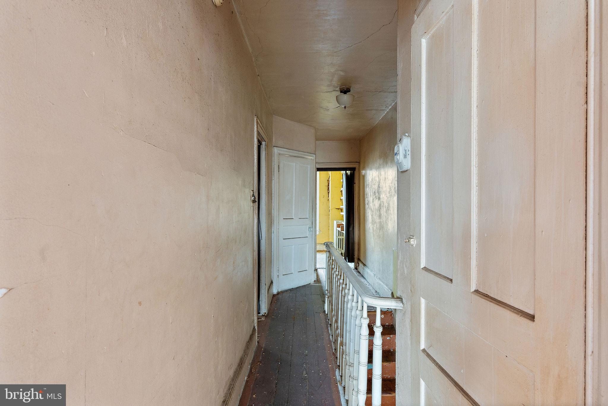 610 Point Street Camden, NJ 08102 - Photo 20 of 23 a view of a hallway with wooden floor and staircase