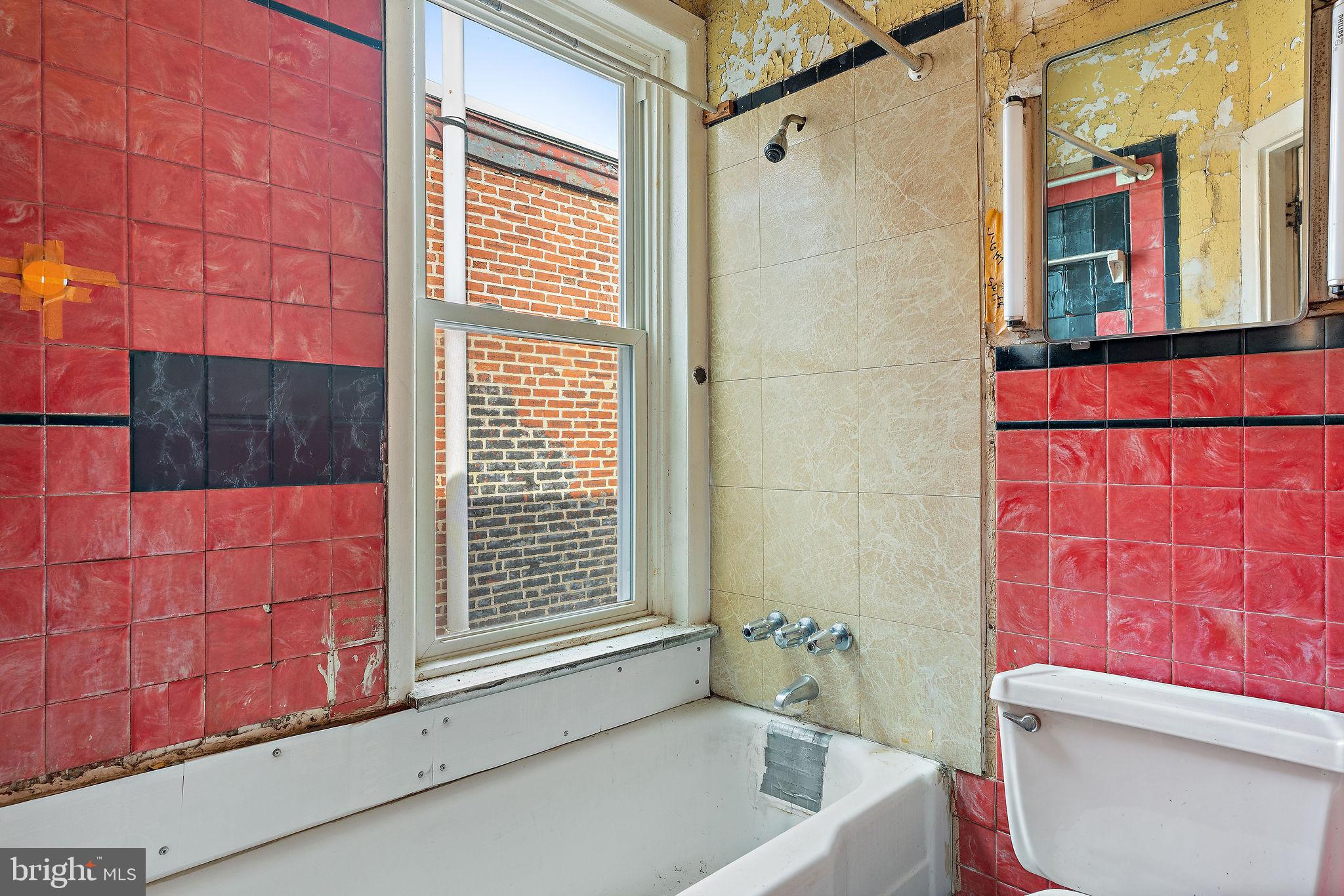 610 Point Street Camden, NJ 08102 - Photo 21 of 23 a bathroom with a bathtub and shower