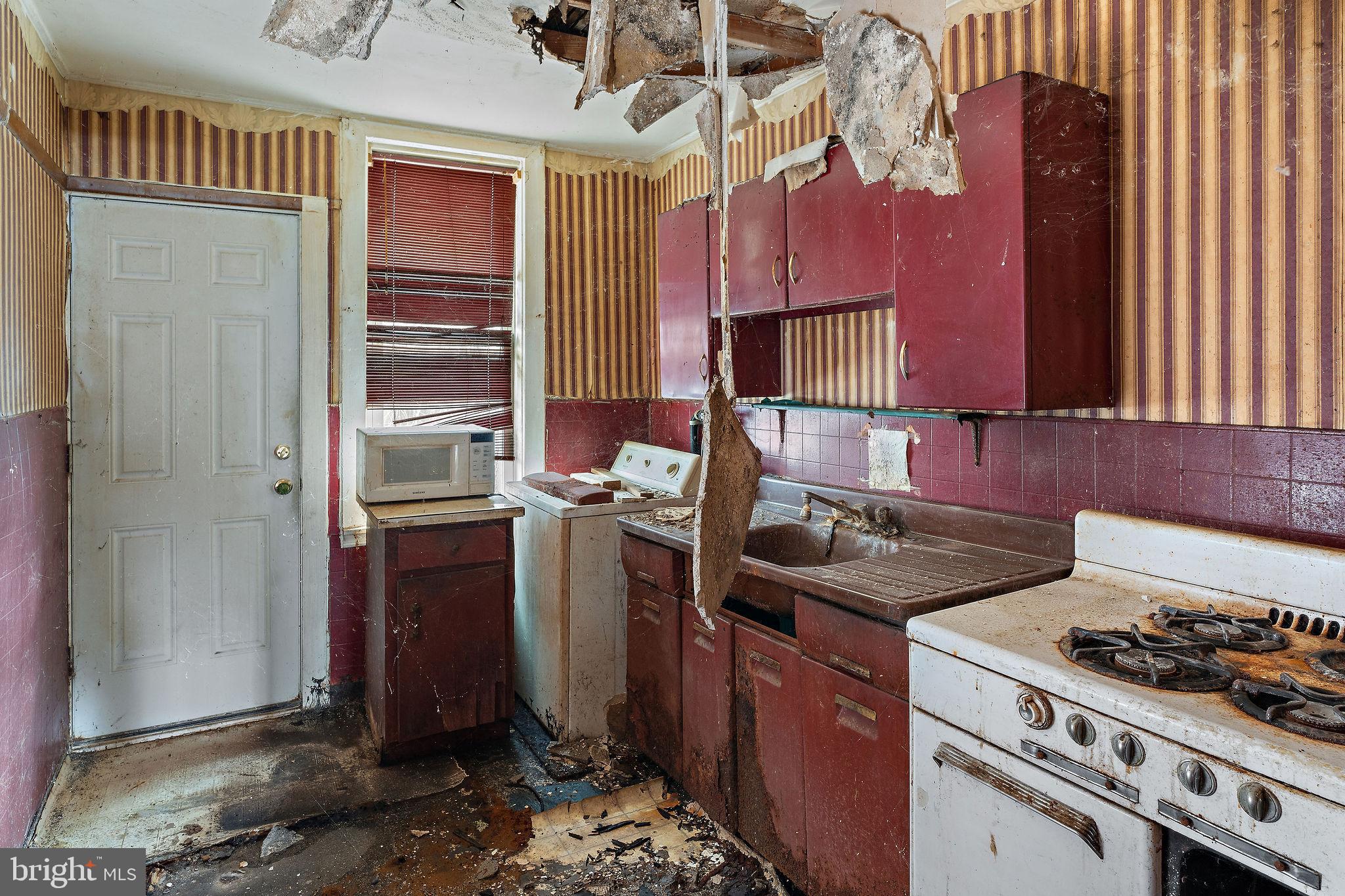 610 Point Street Camden, NJ 08102 - Photo 9 of 23 a kitchen with a stove and a refrigerator