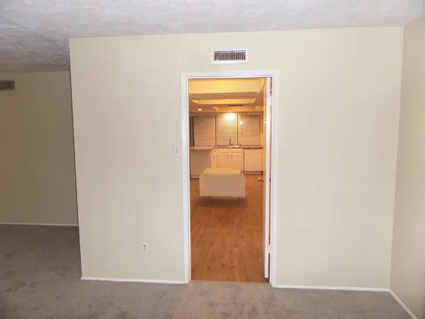 a view of a kitchen cabinets and chandelier