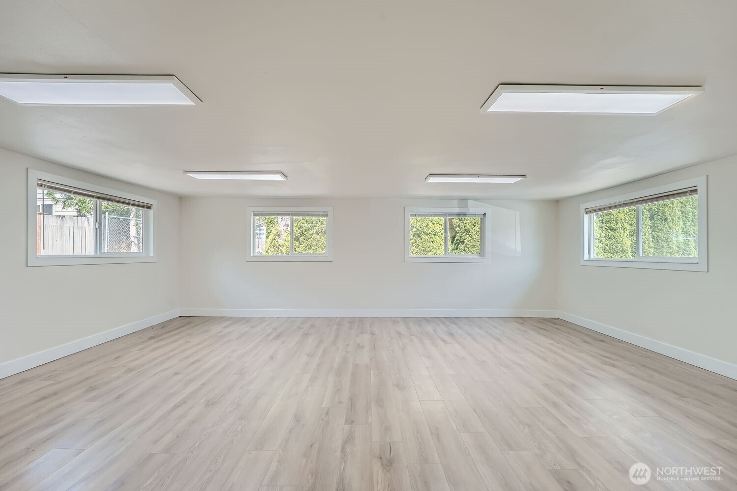 1409 Union Avenue Northeast Renton, WA 98059 - Photo 12 of 23 a view of an empty room with a window and a window