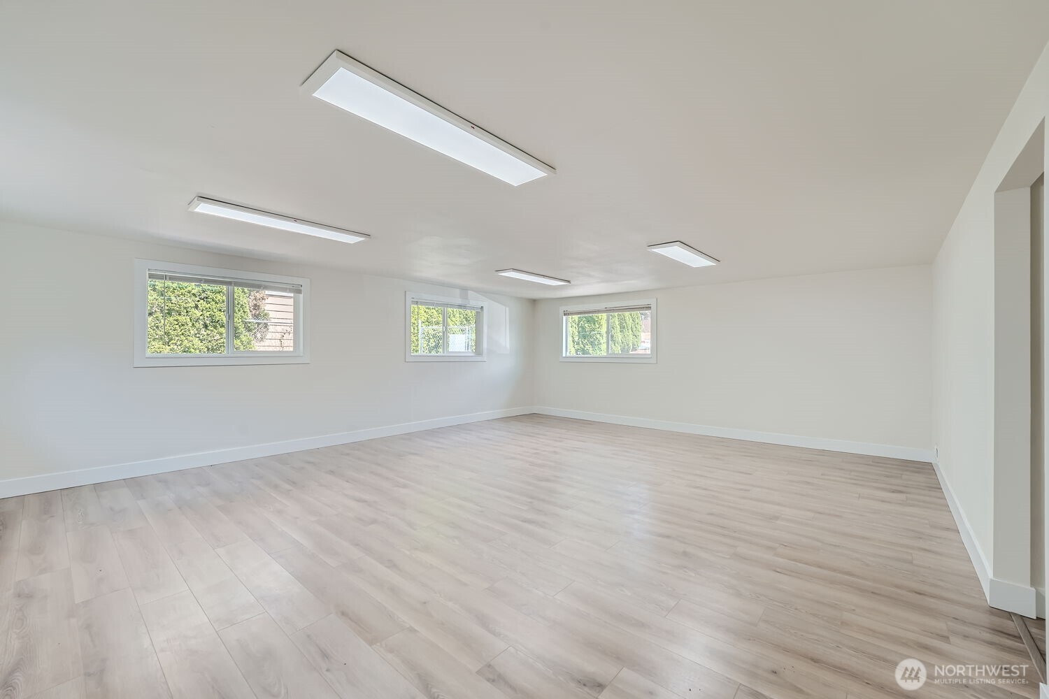 1409 Union Avenue Northeast Renton, WA 98059 - Photo 14 of 23 wooden floor in an empty room with a window