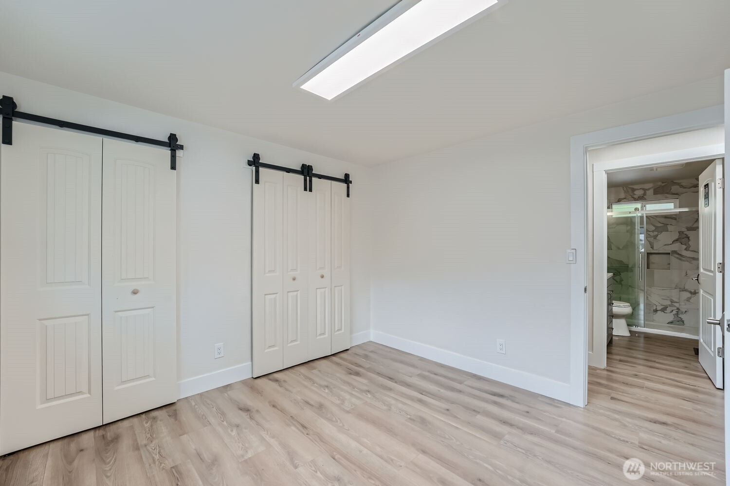 1409 Union Avenue Northeast Renton, WA 98059 - Photo 20 of 23 a view of an empty room with closet and a window