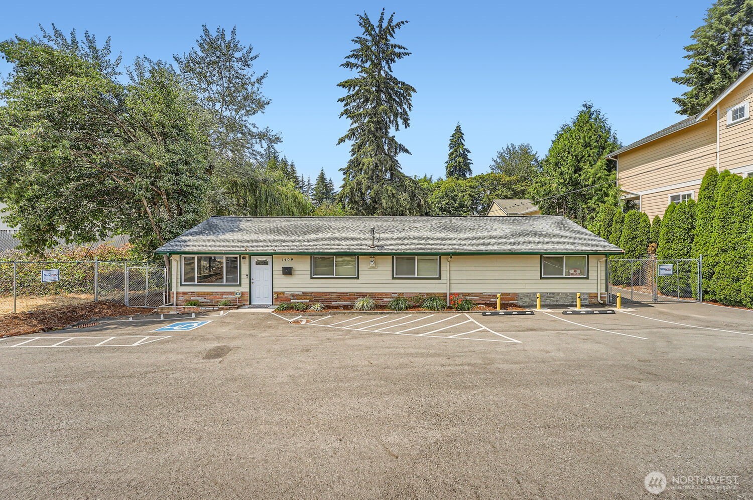 1409 Union Avenue Northeast Renton, WA 98059 - Photo 2 of 23 front view of a house with a patio