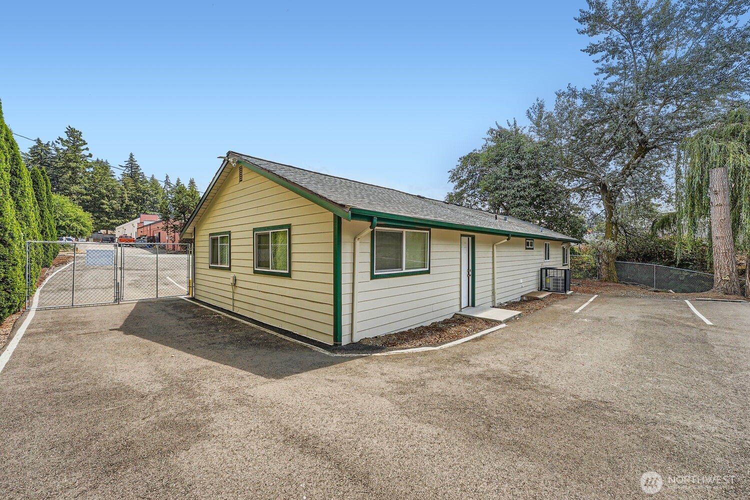 1409 Union Avenue Northeast Renton, WA 98059 - Photo 22 of 23 a view of a house with a yard and garage