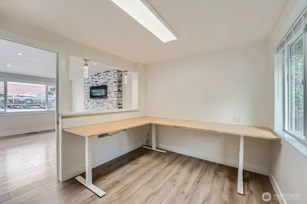 a view of cabinets with wooden floor and window