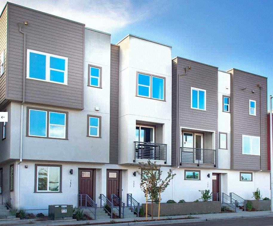 1702 17th Street Oakland, CA 94607 - Photo 1 of 2 a front view of a building with potted plants