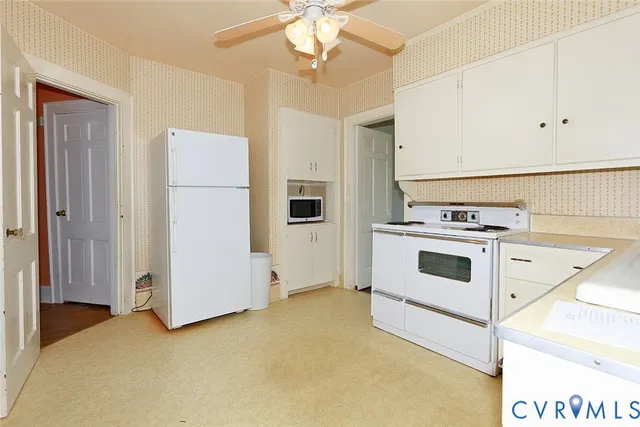 a view of kitchen with cabinets and stainless steel appliances