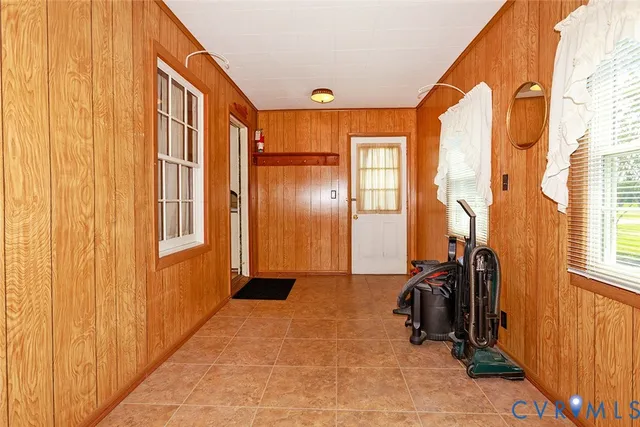 a view of a room with gym equipment and a window