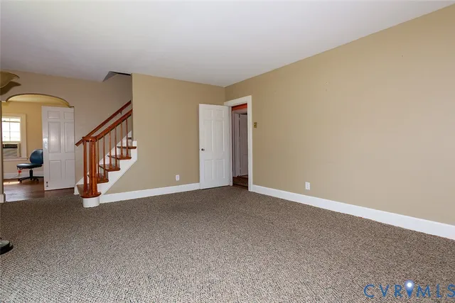 a view of an empty room with windows