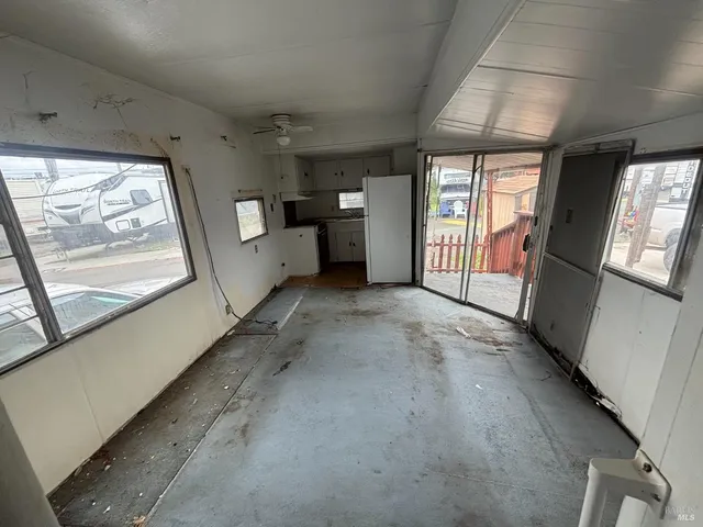 a view of a hallway with a large window