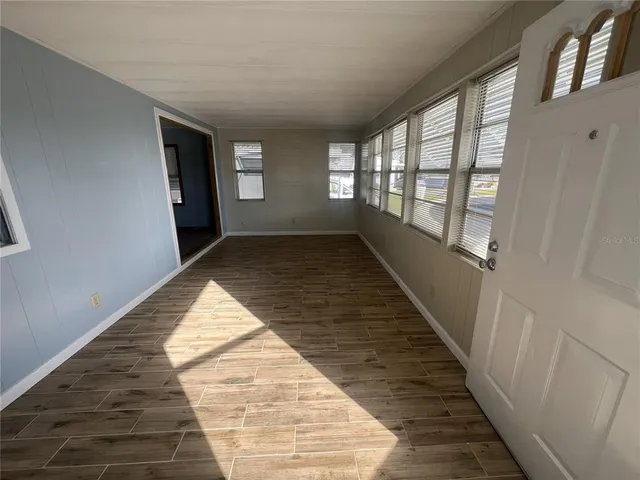 a view of hallway with windows