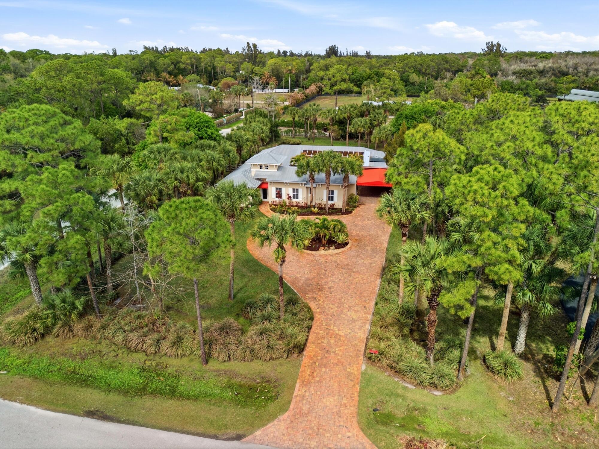 9483 166th Way North Jupiter, FL 33478 - Photo 1 of 48 52_dji_20260302125358_0009_d