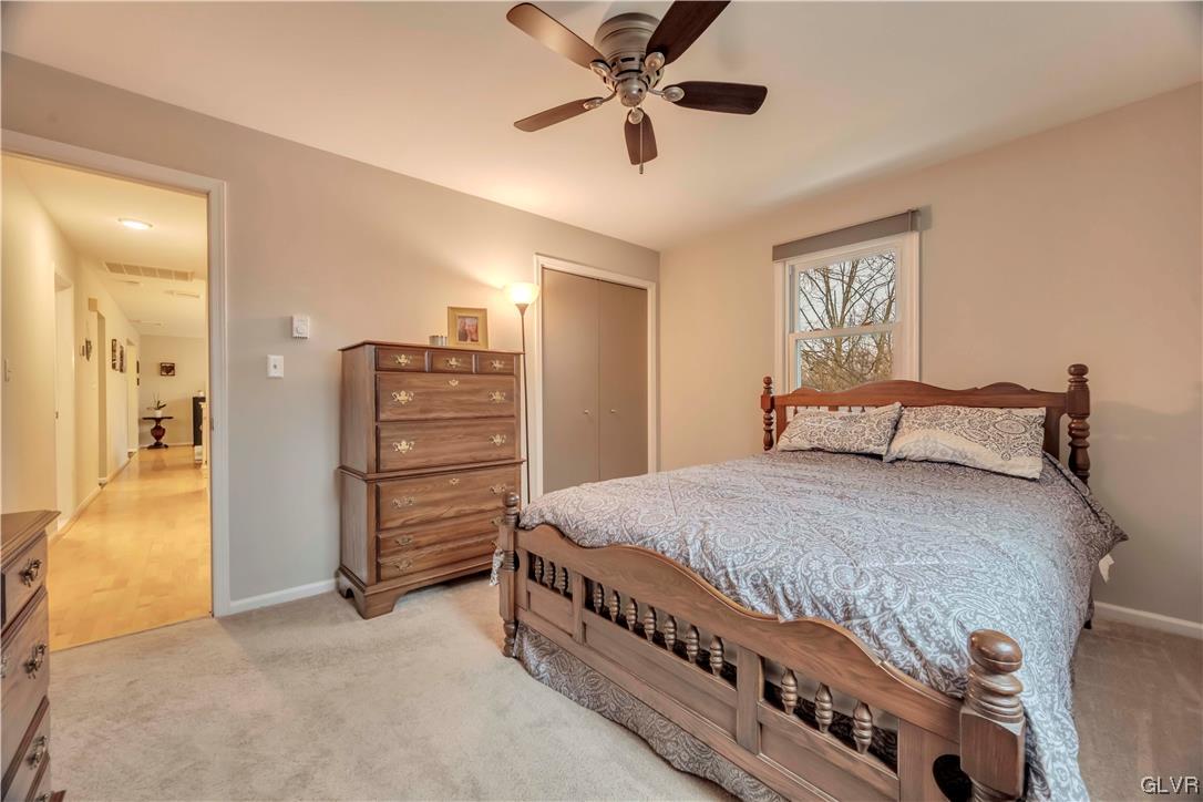 2559 Mountain Road Slatington, PA 18080 - Photo 21 of 32 a bedroom with a bed and a chandelier