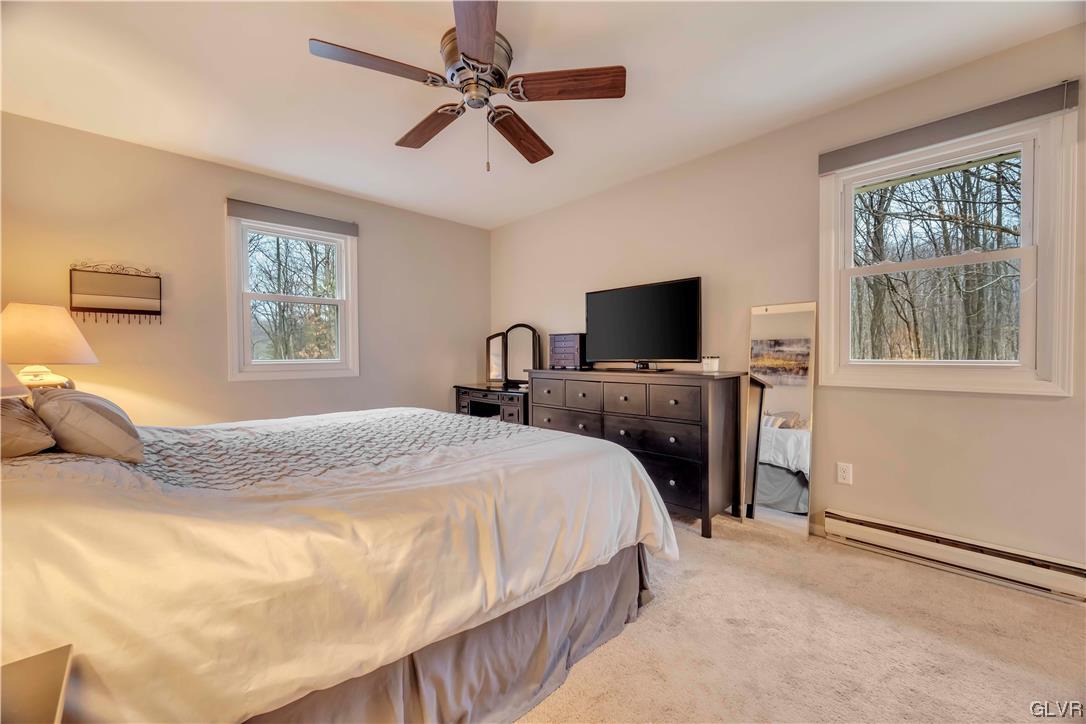 2559 Mountain Road Slatington, PA 18080 - Photo 22 of 32 a bedroom with a bed a window and a flat screen tv