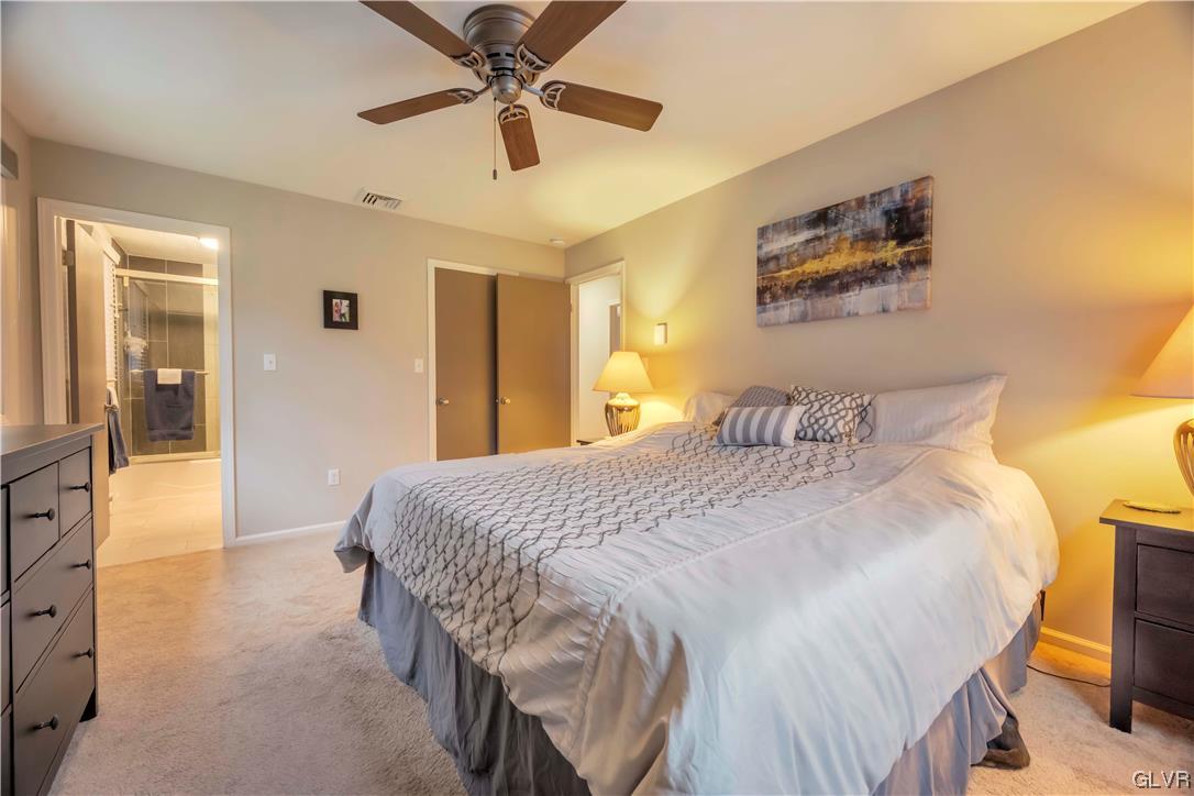 2559 Mountain Road Slatington, PA 18080 - Photo 23 of 32 a bedroom with a bed and a chandelier